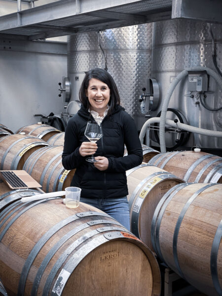 Image of winemaker Ashley Herzberg in a barrel/tasting room