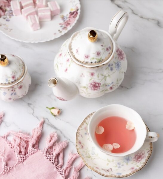 White tea pot and tea cups with pink tea from the St Regis Hotel Atlanta