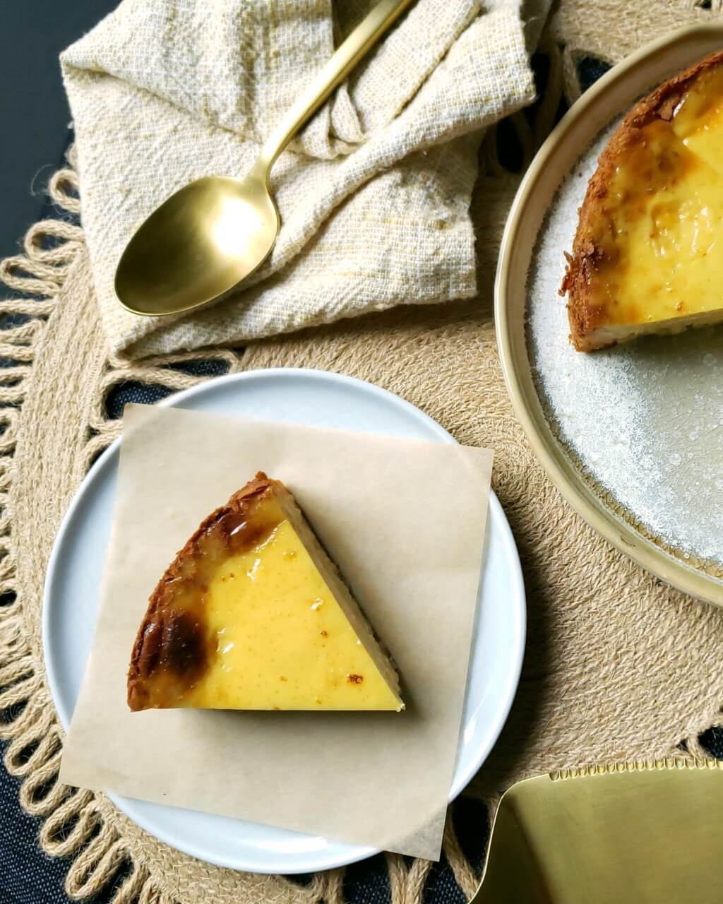 Slice of custard pie dessert on parchment paper on top of a plate