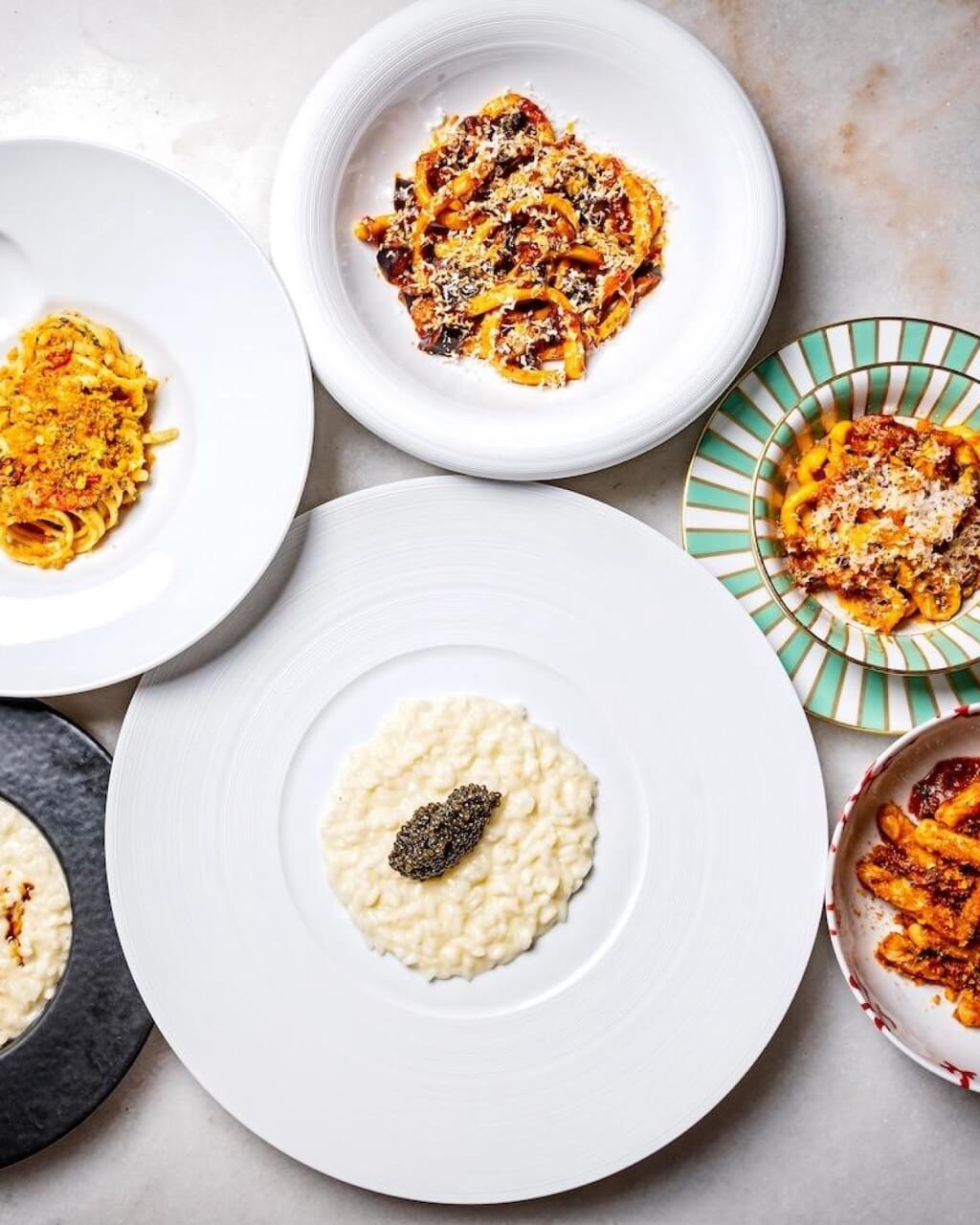 Overhead of plated dishes in various sizes on a granite counter