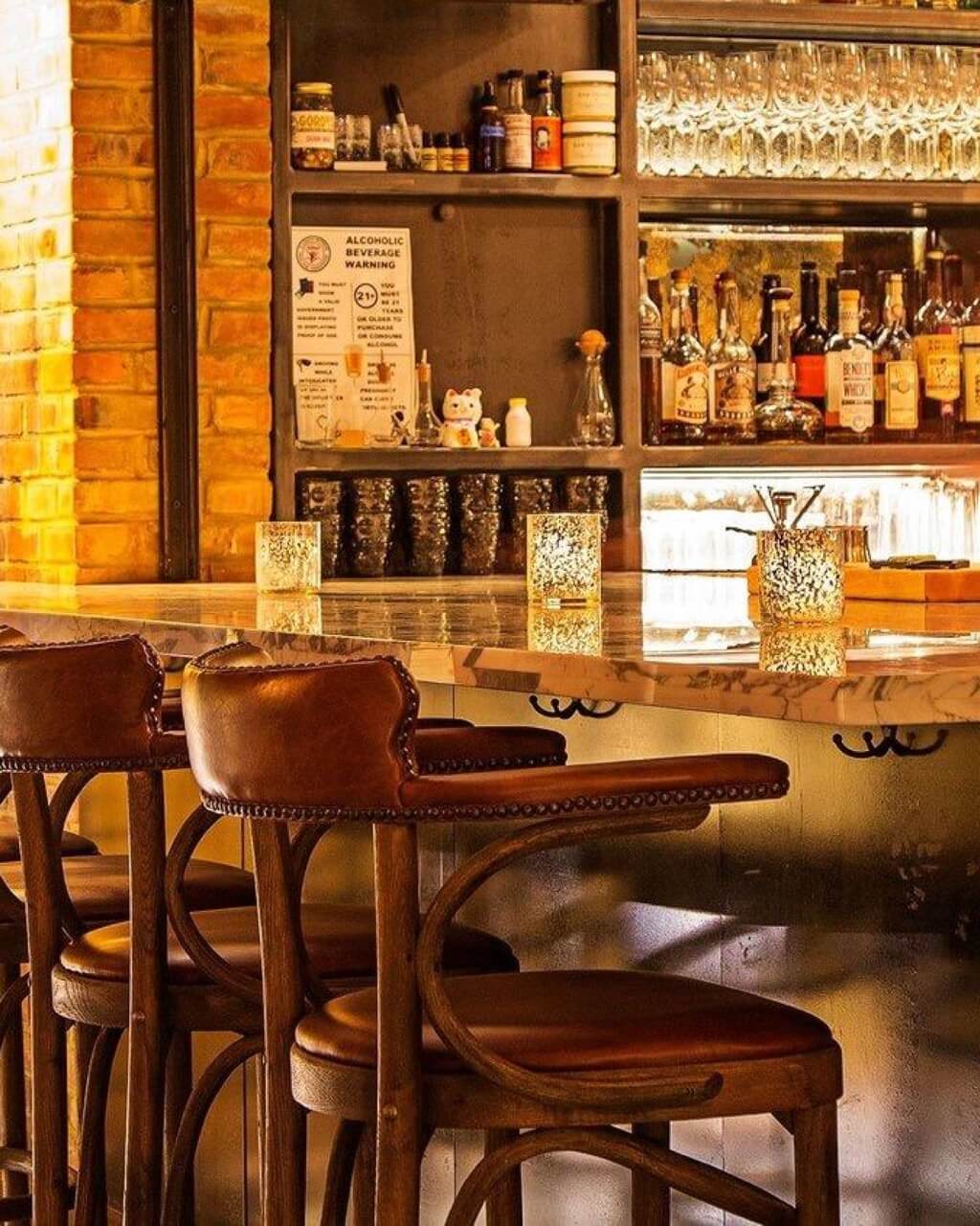 Counter with empty bar height chairs
