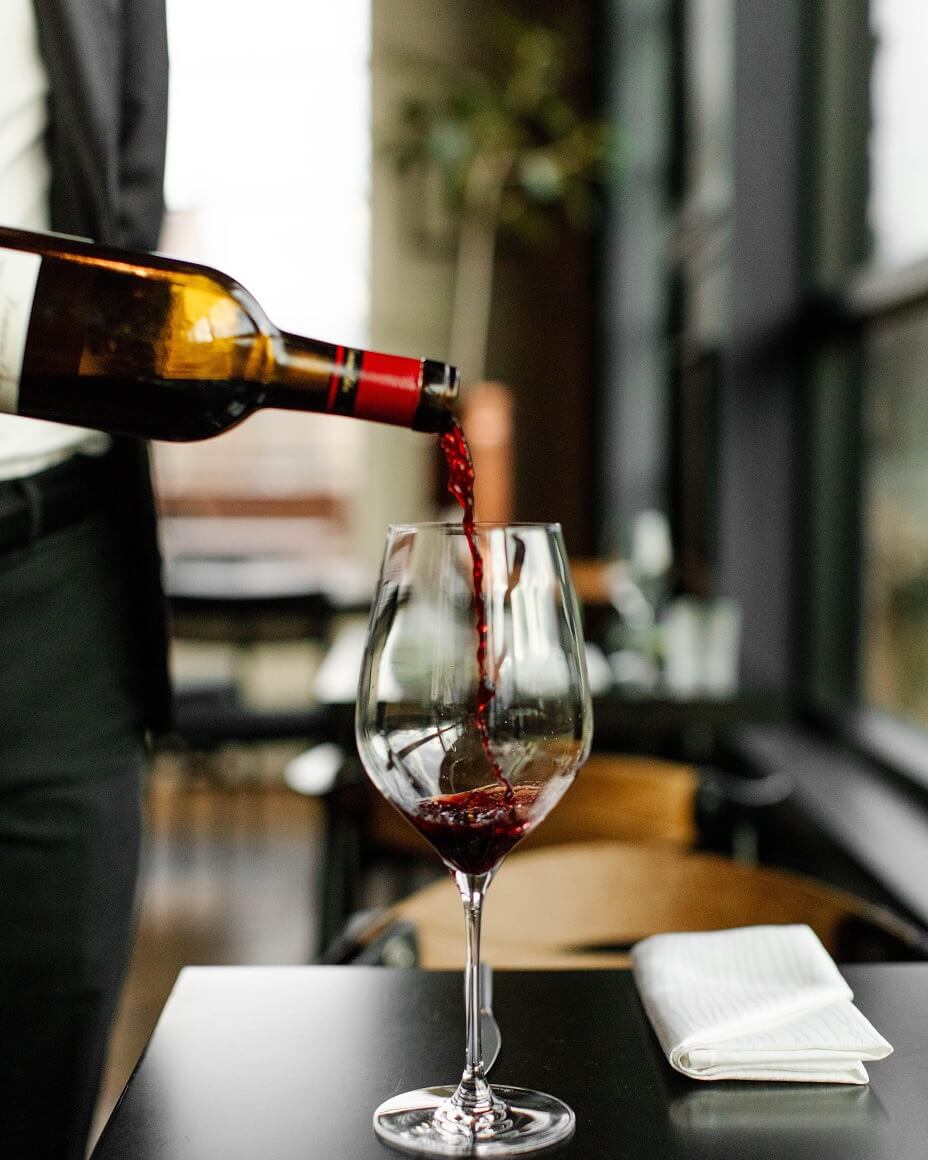 Red wine being poured into glass