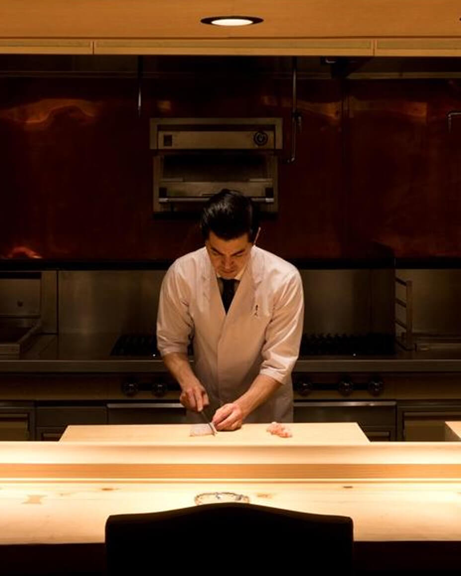 Chef Brandon Hayato Go slicing fish at Hayato’s omakase counter