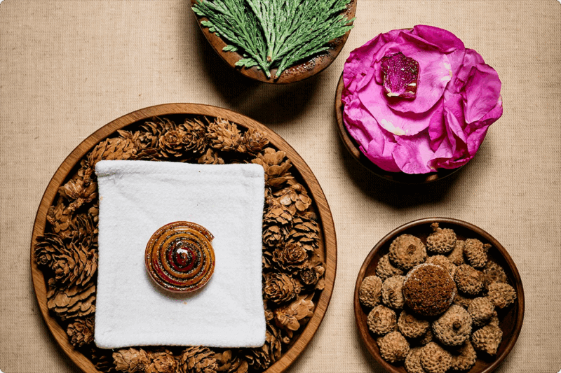 Four elegantly plated dishes on wooden plateware
